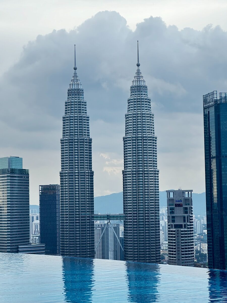 A large swimming pool in front of tall buildings