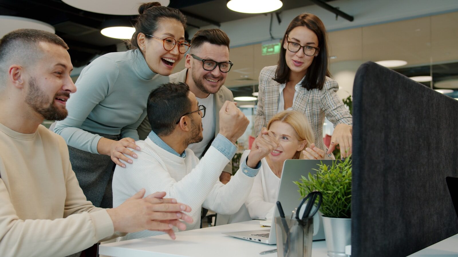 Engaged Malaysian team celebrating together during an employee engagement activity
